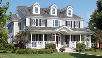 a white house with a red front door