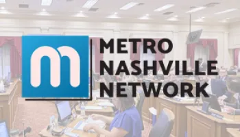 Metro Nashville Network logo with blue square and white "m" on modern office background.