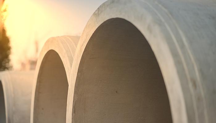 large pipes with a sunset background