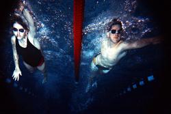 Underwater photo of two people swimming