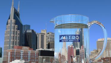 Photo of a pitcher of clear water juxtaposed in front of Nashville skyline buildings