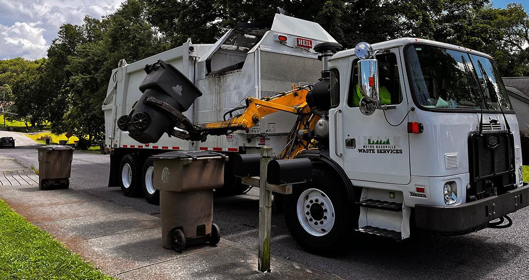 Waste Services truck collecting garbage