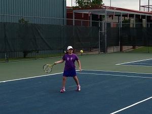 Tournament photo girl hitting ball