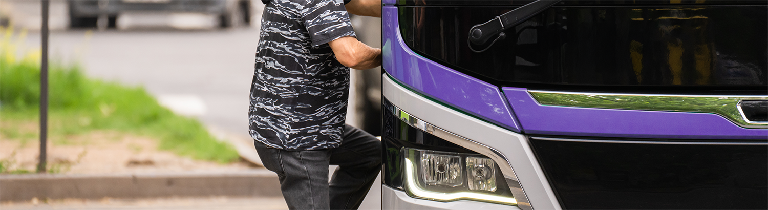 Photo of a public transit rider boarding bus
