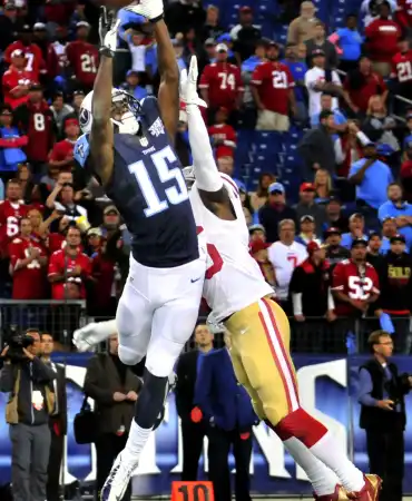Titans player catching football