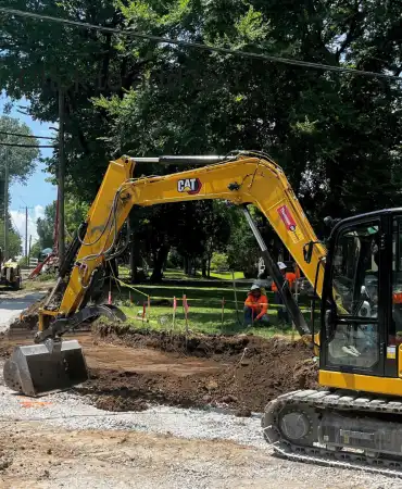Grading for sidewalk and roadway on Estes Road and Hobbs Road