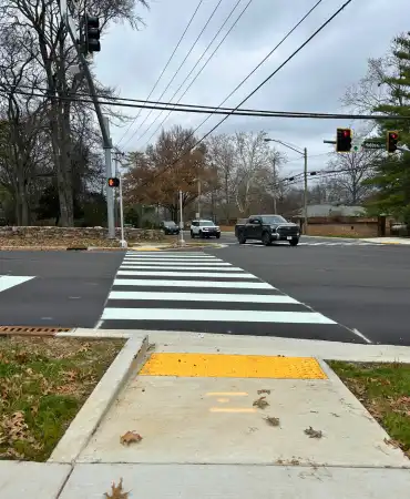 Croswalk and ADA complaint sidewalk on the corner of Hobbs Rd and Estes Road