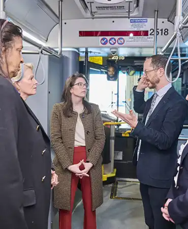 Photo of Mayor O'Connell and others on a bus