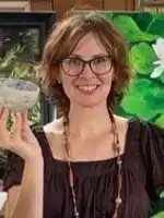 picture of artist holding a ceramic moon bowl\